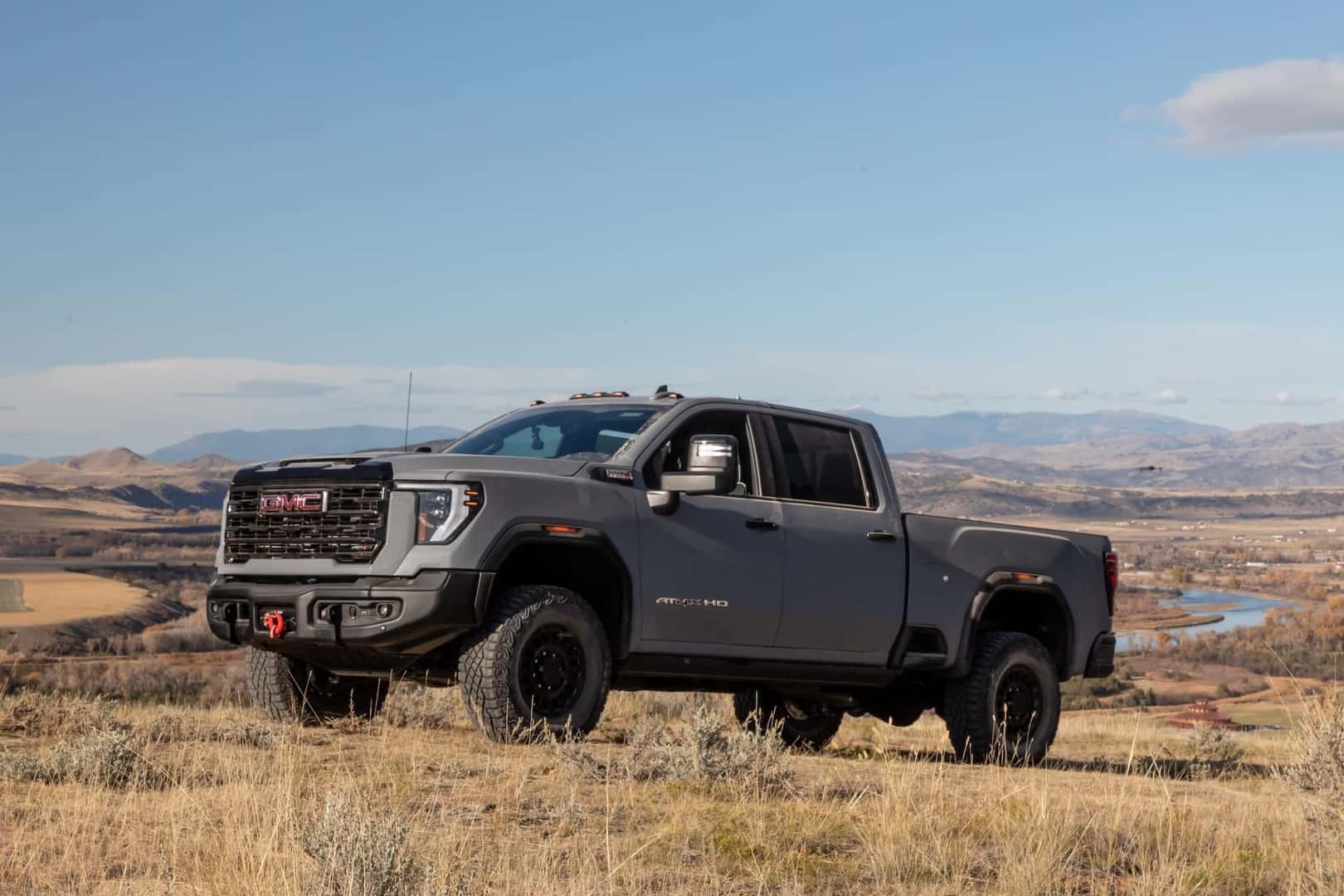 GMC Sierra HD 2024 on an uphill prairie incline