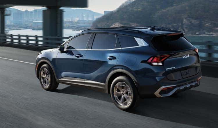 Side profile of blue kia suv