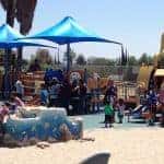 Kids playing on Shane's Inspiration playground
