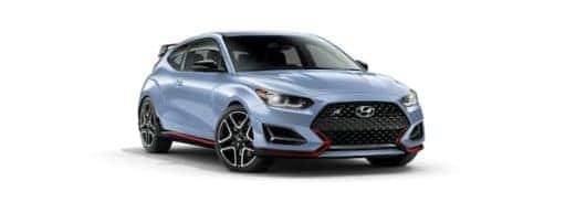 A blue 2022 Hyundai Veloster N is angled left.