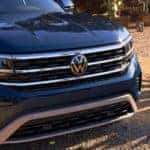 A close up shows the grille of a blue 2022 Volkswagen Atlas at a Bellevue VW dealership.