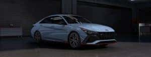 A blue 2022 Hyundai Elantra N is angled right.