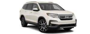 A white 2022 Honda Pilot Touring is shown angled right.