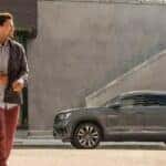 A 2023 Volkswagen Atlas Cross Sport is shown parked near stairs.