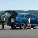 A 2023 Volkswagen Atlas is shown near a lake.