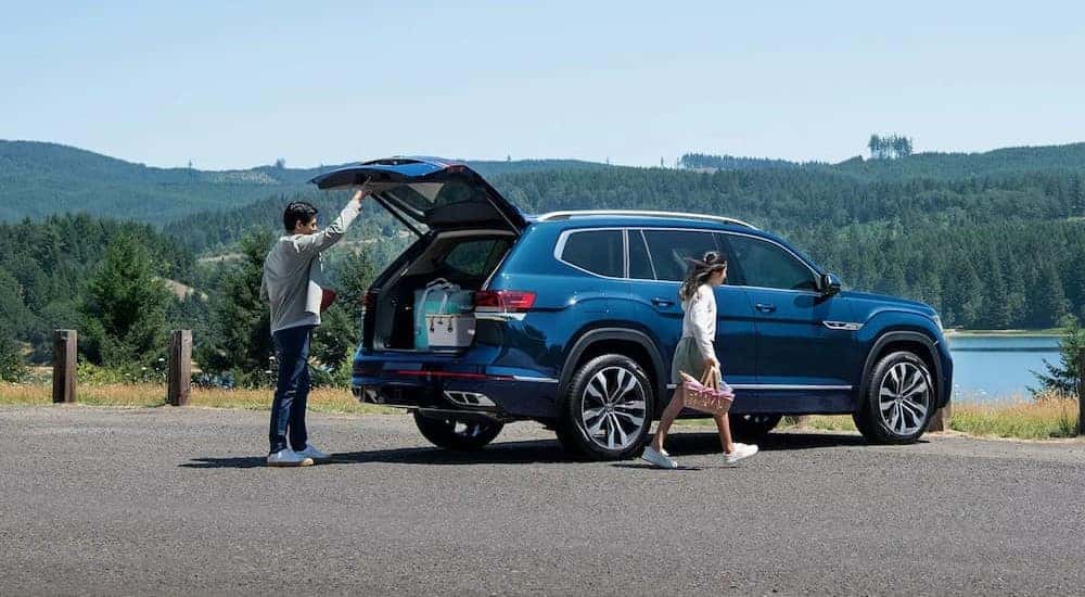 A 2023 Volkswagen Atlas is shown near a lake.