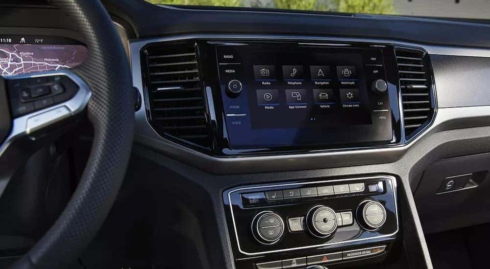 The interior and dash of a 2023 Volkswagen Atlas Cross Sport is shown.