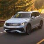 A white 2023 Volkswagen Tiguan is shown from the front at an angle.