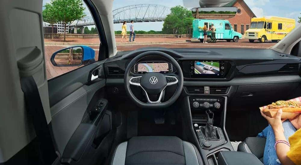 The black interior and dash of a 023 Volkswagen Toas is shown.