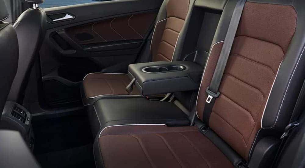 The black and brown rear interior of a 2023 Volkswagen Tiguan is shown.