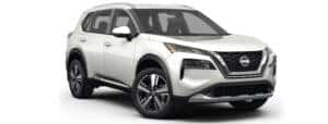 A white 2023 Nissan Rogue is shown from angled right.