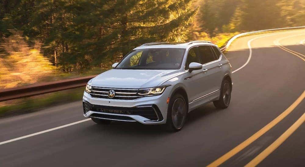 A white 2023 Volkswagen Tiguan is shown from the front at an angle.