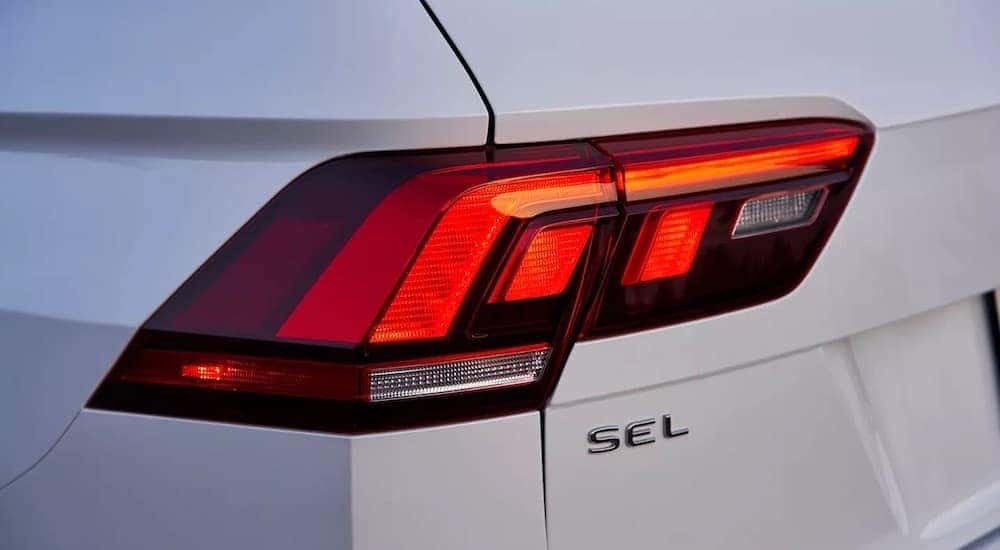 The Rear Taillight of a white 2023 Volkswagen Tiguan SEL R-Line is shown in a close up.