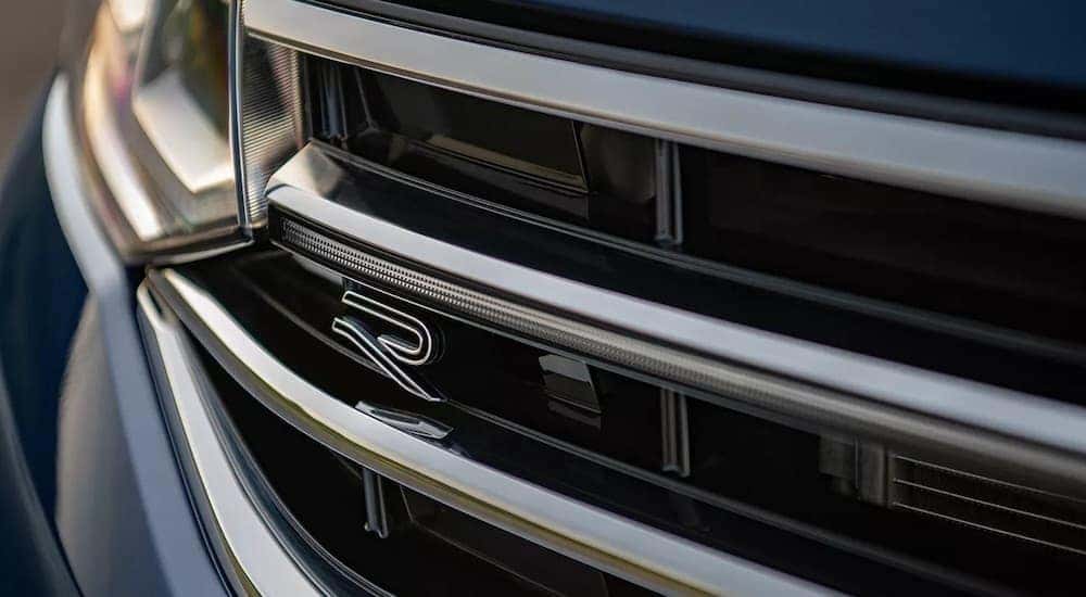 The front badge of a 2023 Volkswagen Tiguan SEL R-Line is shown in close up after leaving a Seattle VW Tiguan dealer.