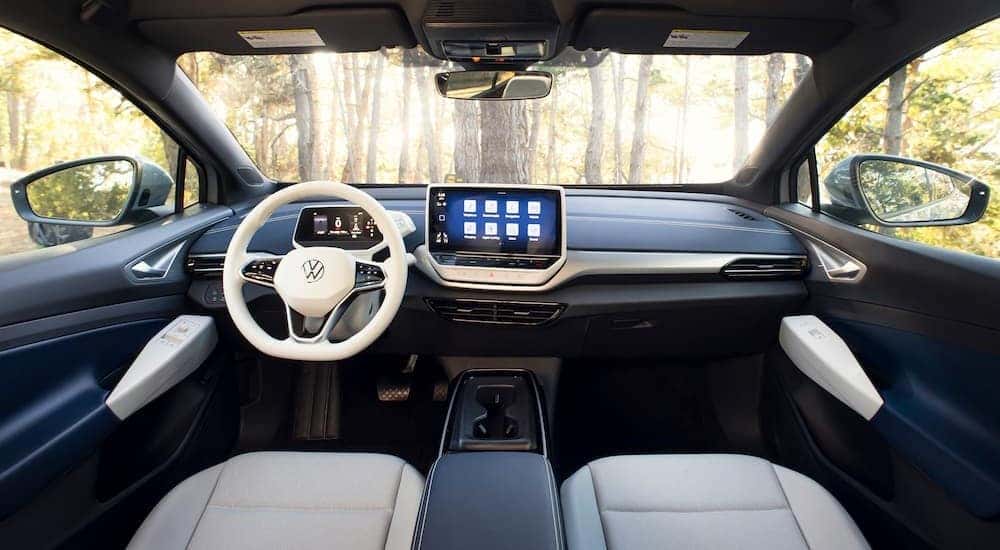 The black and white interior and dash of a 2023 Volkswagen ID.4 is shown.
