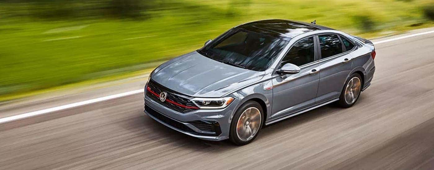 A grey 2021 Volkswagen Jetta GLi is shown from the front at an angle.