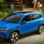 A blue 2024 Volkswagen Taos is shown parked near the most experienced VW dealer Redmond, WA, has to offer.