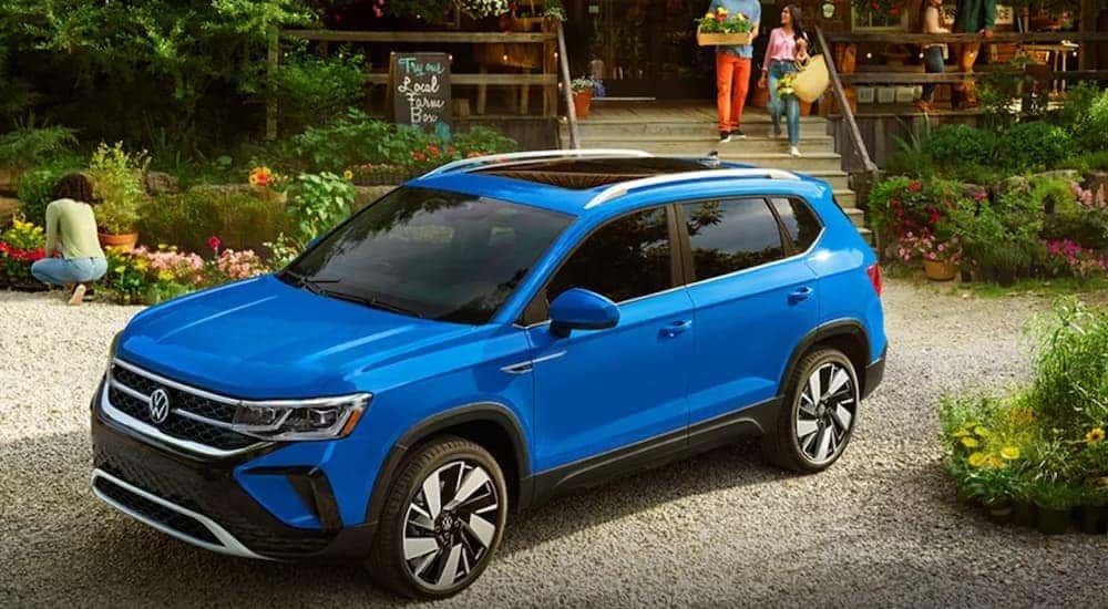 A blue 2024 Volkswagen Taos is shown parked near the most experienced VW dealer Redmond, WA, has to offer.