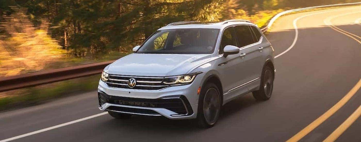 A white 2023 Volkswagen Tiguan is shown from the front at an angle after leaving a Puyallup VW dealer.