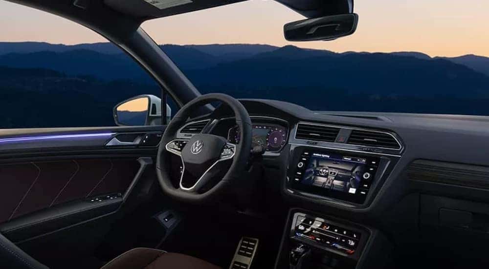 The black interior and dash of a 2023 Volkswagen Tiguan is shown.
