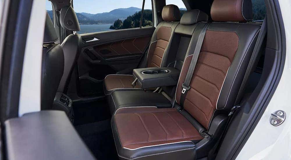 The black and brown second row of seating in a 2024 Volkswagen Tiguan for sale at a Volkswagen dealer near SeaTac.