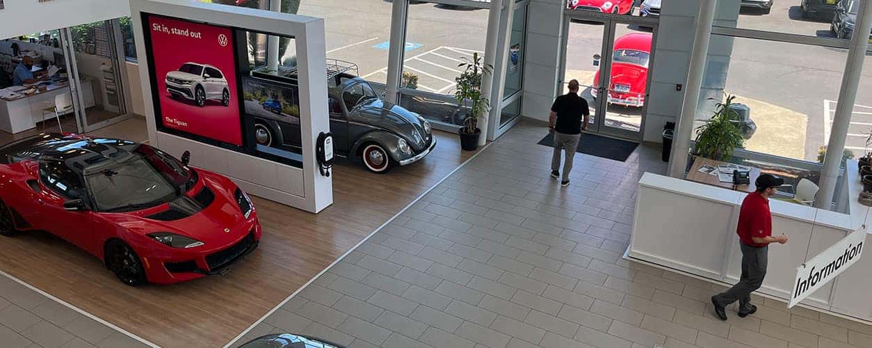 Entrance of Bud Clary Auburn VW with people walking around inside