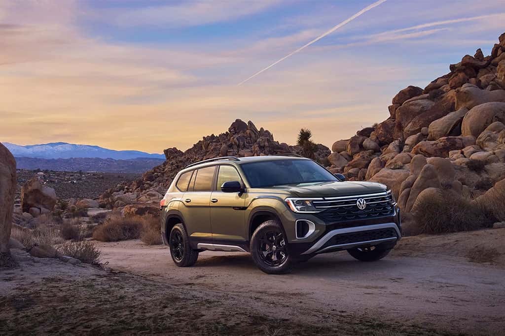 2026 VW Atlas in Avocado Green driving offroad in the desert