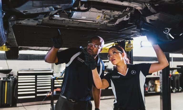 Mercedes-Benz Service EQS Service Techs Under Car