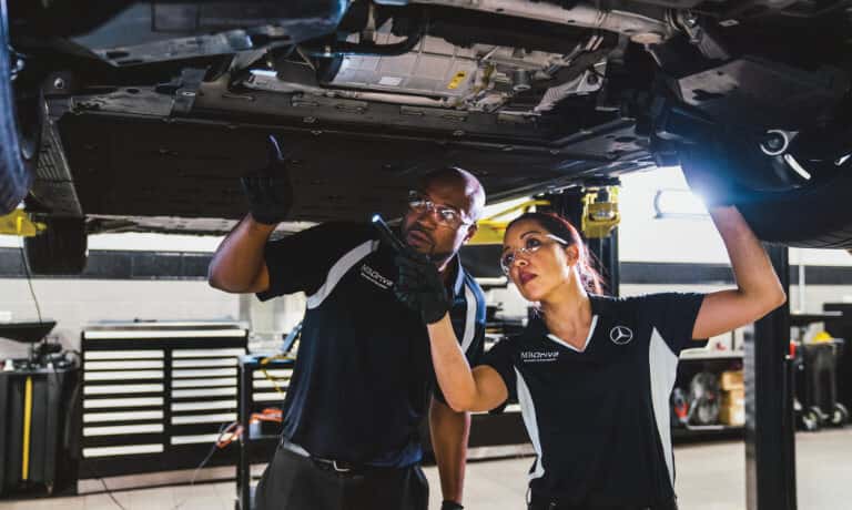 Mercedes-Service EQS Service Techs Under Car