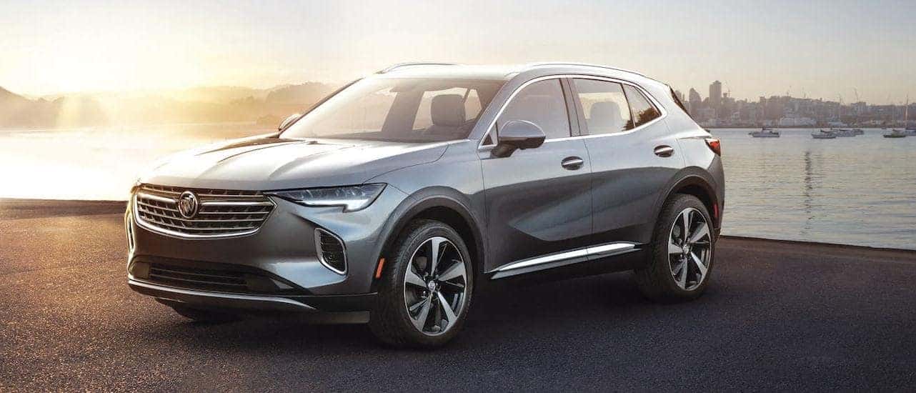 A gray 2021 Buick Envision is parked in front of a pier near Lexington, KY.