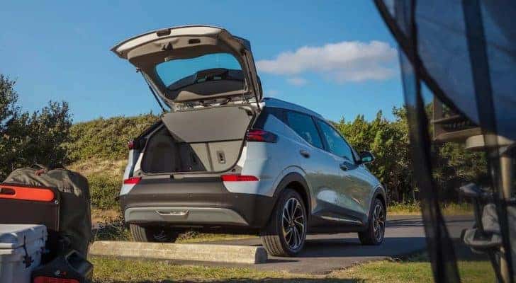 A silver 2022 Chevy Bolt EUV is shown from the rear with the lift gate open.