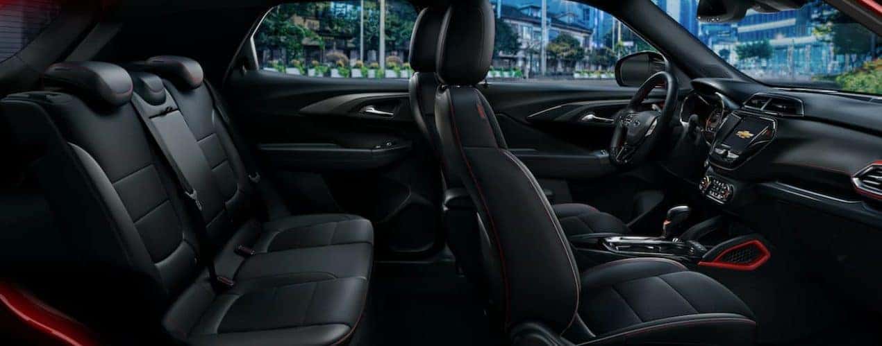 The black interior of a 2022 Chevy Trailblazer shows two rows of seating.