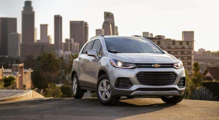 A a silver 2021 used Chevy Trax for sale is shown parked on a hill.