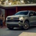 A popular used Chevy Silverado for sale, a silver 2023 Chevy Silverado Z71, is shown parked on a driveway.