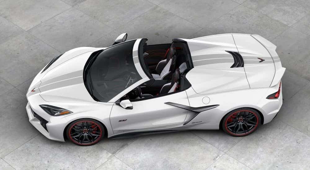 A white 2023 Chevrolet Corvette Z06 70th Anniversary Edition is shown parked.