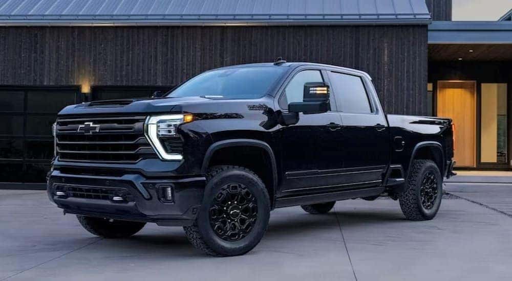 A black 2024 Chevy Silverado 2500 High Country for sale near Covington is shown.