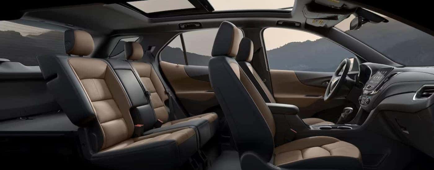 The black and brown interior in a 2024 Chevy Equinox is shown.