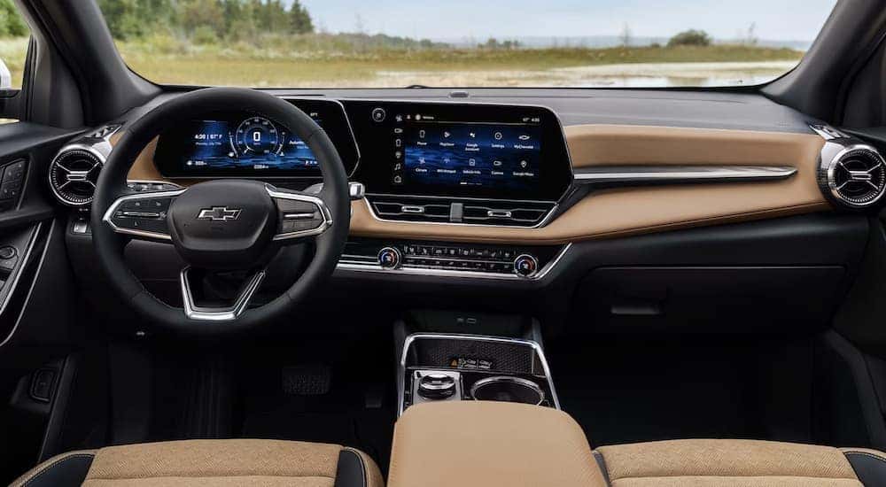 The black and brown interior of a 2025 Chevy Equinox ACTIV for sale near Florence.
