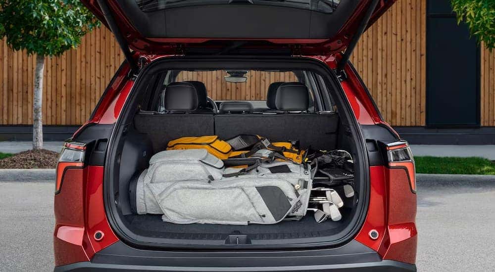 The rear cargo area of a red 2025 Chevy Equinox RS.