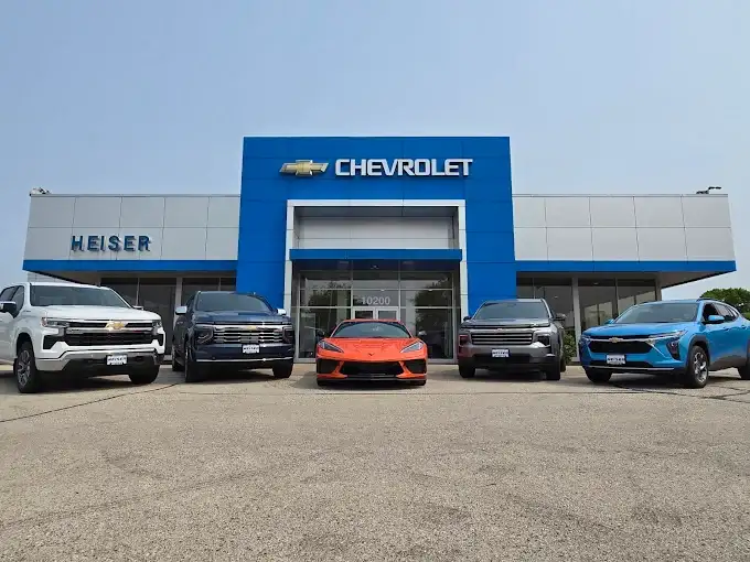 An exterior shot of a Chevrolet dealership during the day.