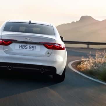 2018 Jaguar XF rear end view driving