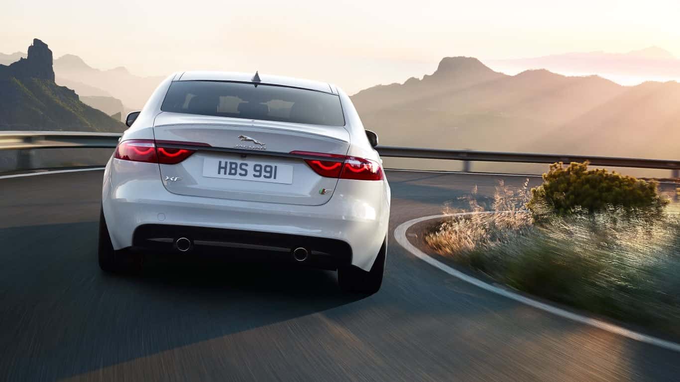 2018 Jaguar XF rear end view driving