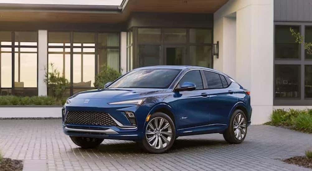A blue 2024 Buick Envista is shown parked on a driveway after viewing Buick SUVs for sale.