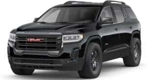 A black 2023 GMC Acadia AT4 is shown angled left.