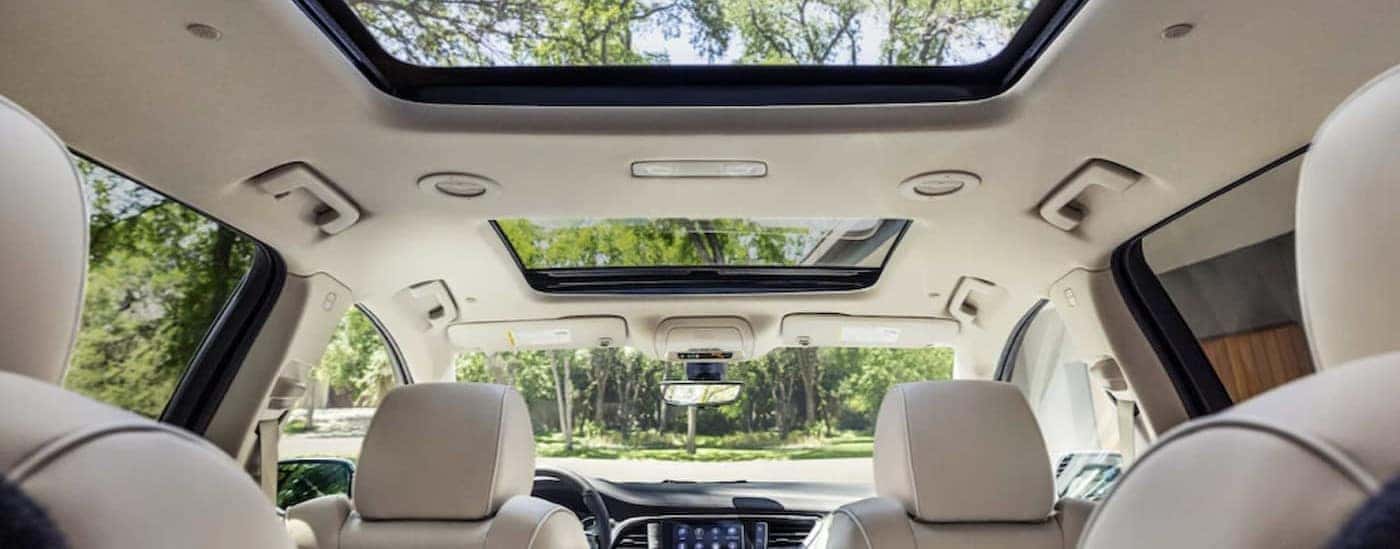 The white interior of a 2023 Buick Enclave is shown.