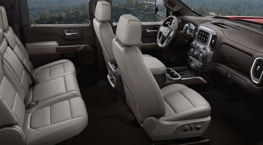 The black and grey interior of a 2024 GMC Sierra 3500 HD is shown.