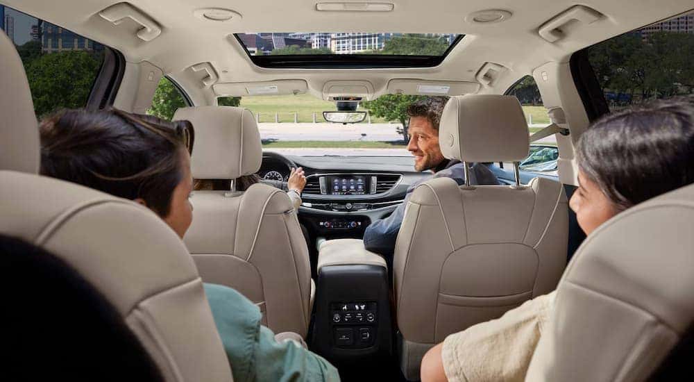 A family is test driving a 2024 Buick Enclave at a Buick dealer near Gainesville.