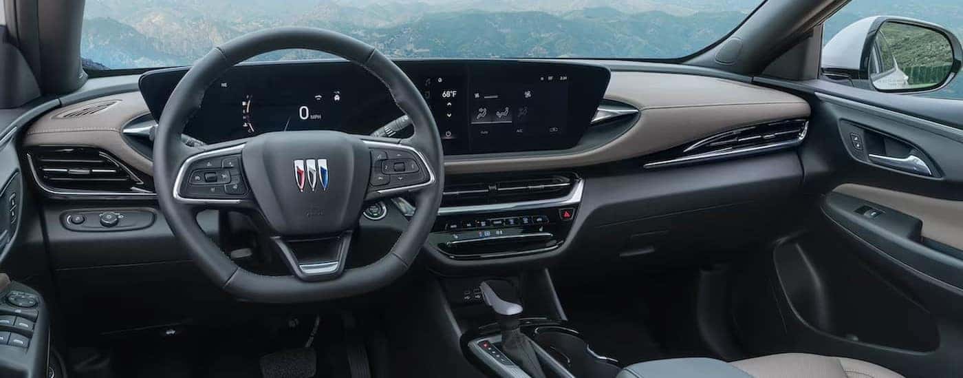 The black and brown interior and dash in a 2025 Buick Envista is shown.