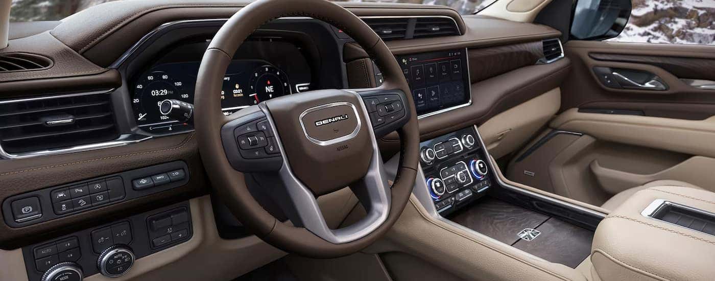 The cockpit of a 2024 GMC Yukon Denali at a GMC dealer.