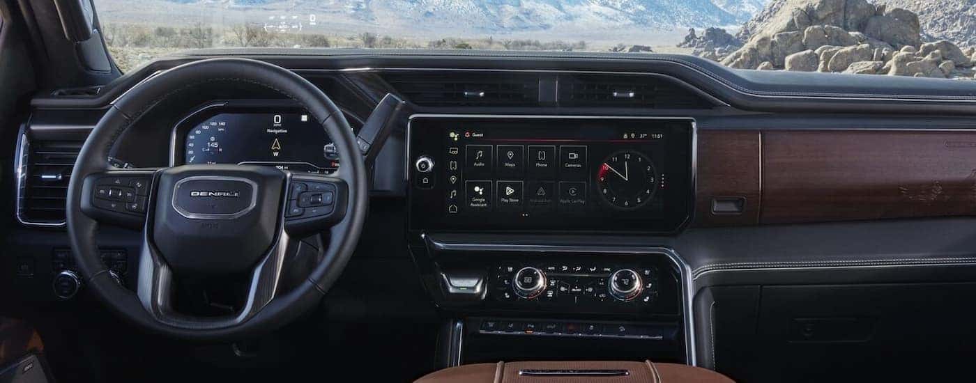 The black and brown dash is shown in a 2024 GMC Sierra 2500 HD Denali.